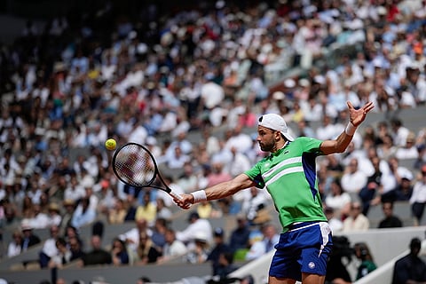 Grigor Dimitrov plays a shot against Jannik Sinner